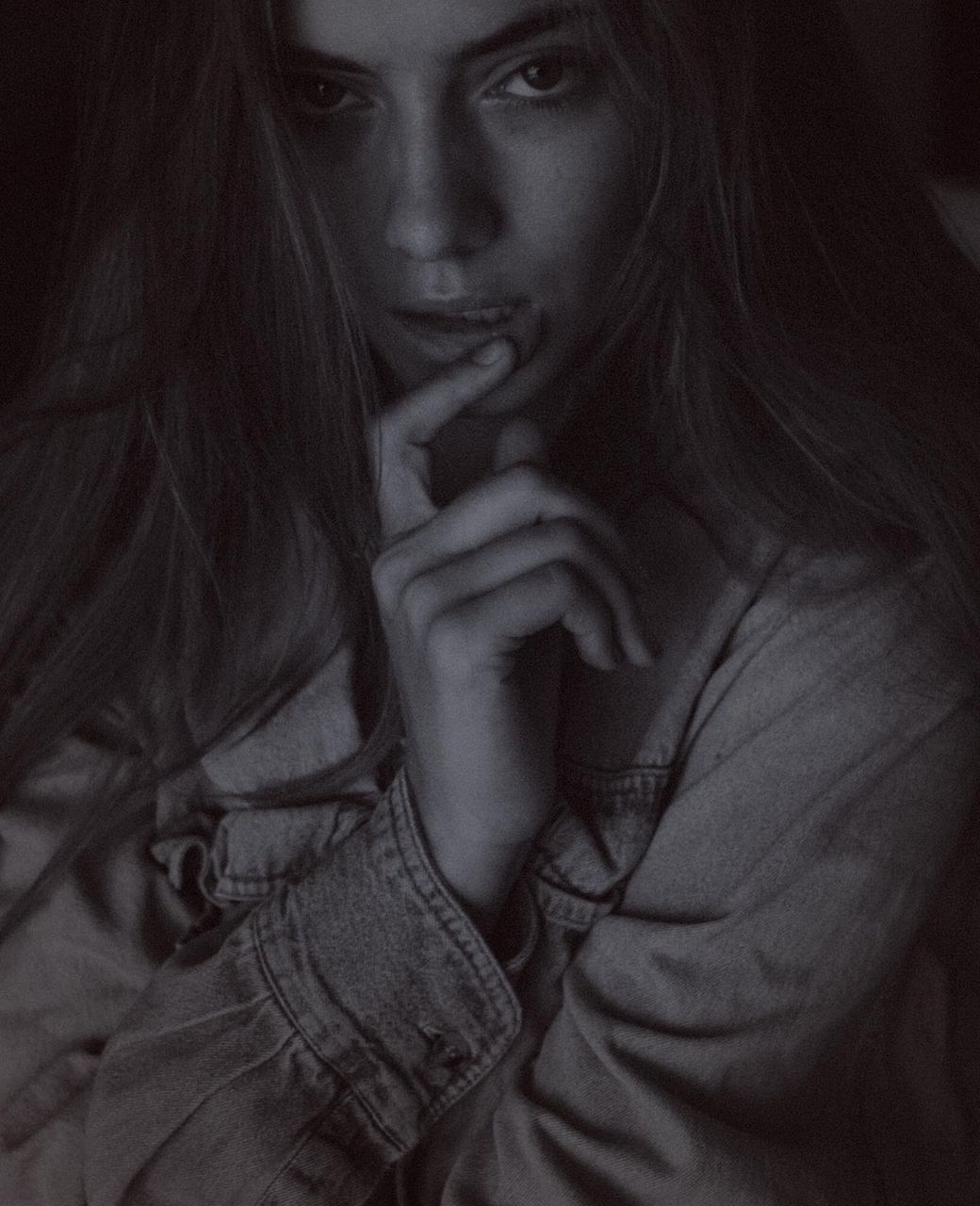 black and white, one person, portrait, women, monochrome, adult, monochrome photography, long hair, black, young adult, looking at camera, darkness, hairstyle, white, indoors, human face, front view, person, female, headshot, dark, emotion, studio shot, fear, serious, contemplation, fashion, sadness, looking