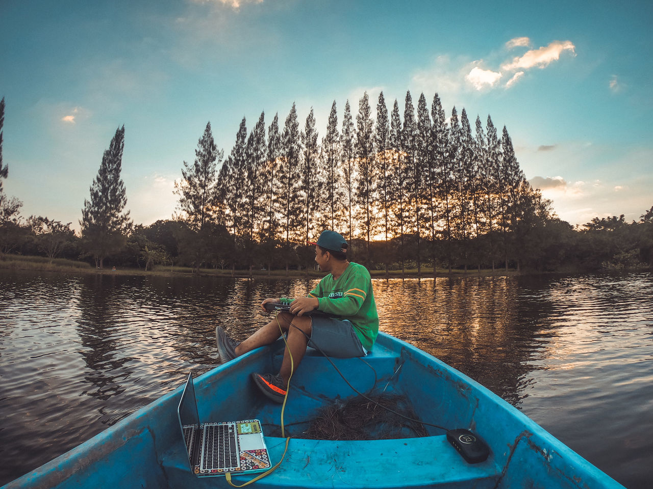 water, sky, real people, nautical vessel, mode of transportation, transportation, nature, beauty in nature, lifestyles, cloud - sky, one person, lake, men, leisure activity, day, sitting, plant, outdoors