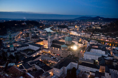 Aerial view of cityscape against sky at dusk