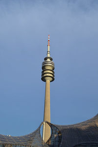 Low angle view of communications tower against sky