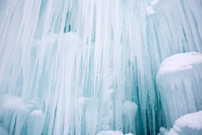 Low angle view of frozen waterfall