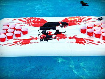 High angle view of red swimming in pool