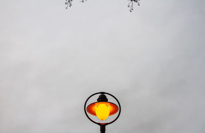 Low angle view of street light against sky