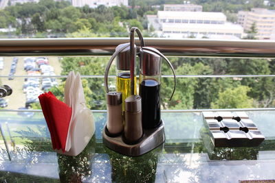 High angle view of ashtray on glass table at restaurant