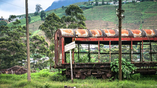 Train by railroad track on mountain