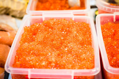 Close-up of caviar in containers for sale at market