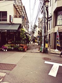 Road by buildings in city