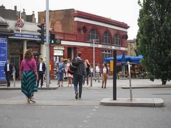 People walking on road in city