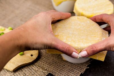 Close-up of hand preparing food