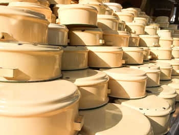 Close-up of stacked containers for sale at market stall