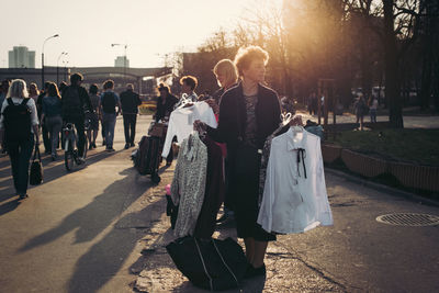 People walking on street in city