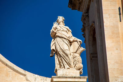 One of the famous statues of the church of san nicolò in noto