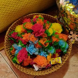 High angle view of various flowers in basket on table