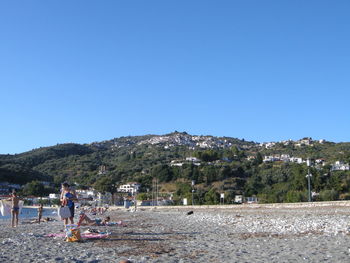 Scenic view of mountains against clear blue sky