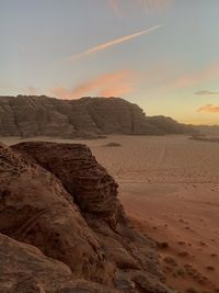 Scenic view of beach against sky during sunset