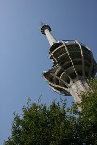 Low angle view of statue against blue sky