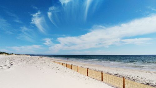 Scenic view of sea against cloudy sky