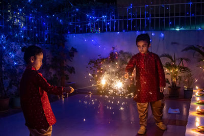 Kids playing with firecrackers during diwali festival
