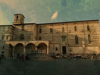 Group of people in front of historical building