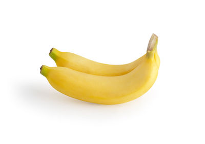 Close-up of yellow fruit against white background