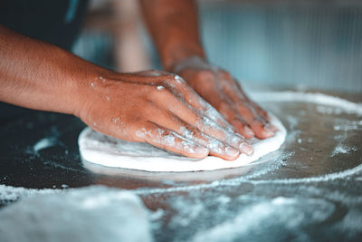 Close-up of man preparing food