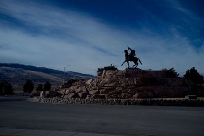 Silhouette of man against cloudy sky