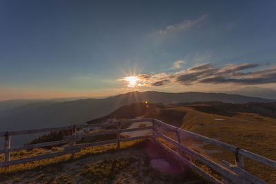 Scenic view of landscape against sky during sunset