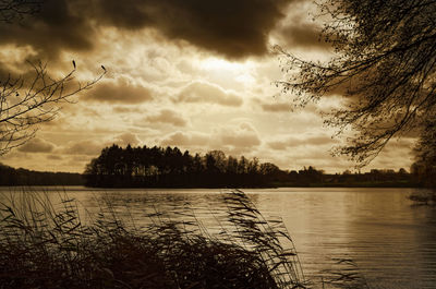 Scenic view of lake against sky during sunset