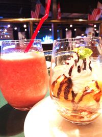 Close-up of ice cream on glass table