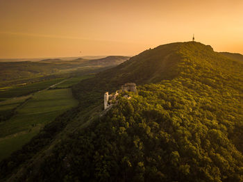 Scenic view of landscape against sky during sunset