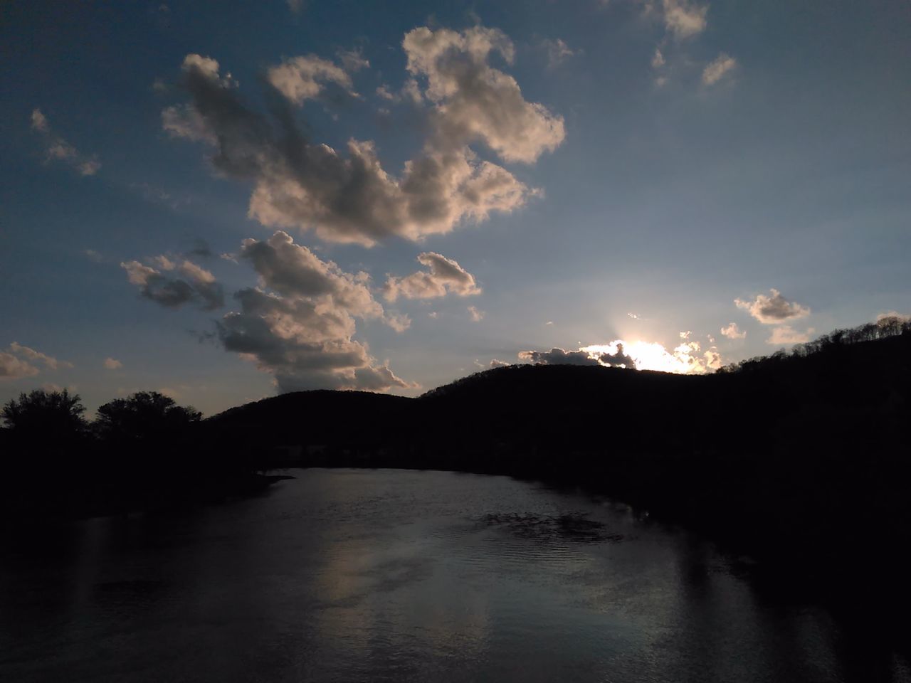 water, sky, sunset, silhouette, reflection, cloud - sky, tranquility, tranquil scene, scenics, beauty in nature, river, tree, cloud, waterfront, lake, nature, sun, sunlight, cloudy, idyllic