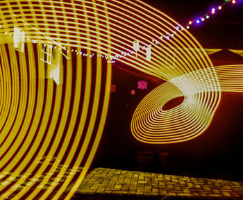 Close-up of illuminated lighting equipment at night