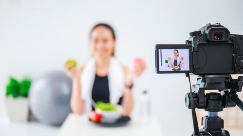 Portrait of woman photographing