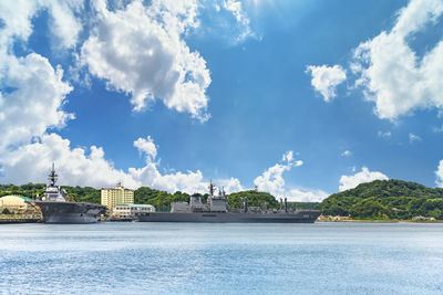 Replenishment oiler js masyu  and the destroyer js izumo  berthed in the yokosuka naval port.