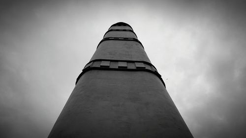 Low angle view of communications tower against sky