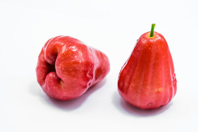 Close-up of strawberry over white background