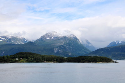 Scenic view of mountains against cloudy sky