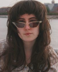 Portrait of young woman with sunglasses