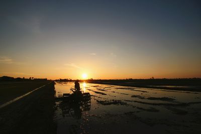 Scenic view of beach against sky during sunset