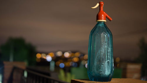 Close-up of wine bottles on table