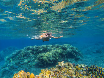 Woman snorkeling in sea