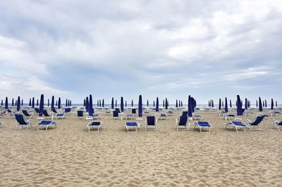 Sunshades and lounge chairs on beach