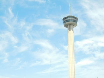 Low angle view of tower against cloudy sky