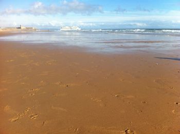 Scenic view of beach against sky