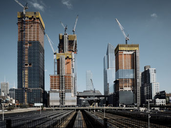 Skyscrapers in city against sky