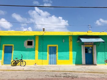 Building and bike against blue sky