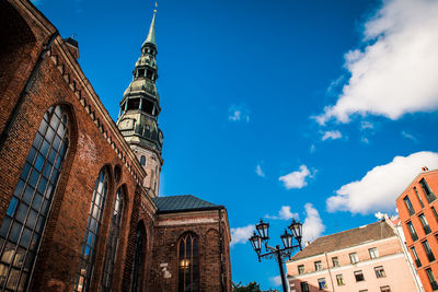 Low angle view of buildings against blue sky