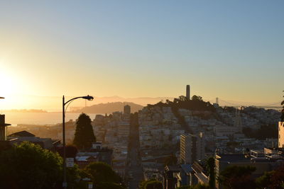 Cityscape against sky during sunset