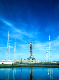 View of factory against blue sky