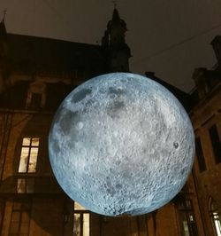 Low angle view of illuminated lamp against sky